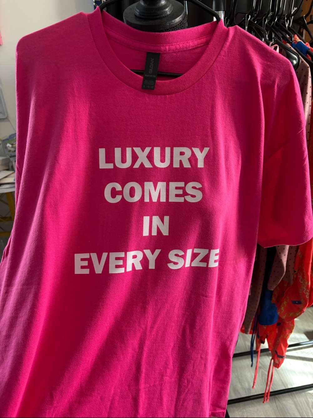 Gildan Hot Pink Short Sleeve Tee with White Text "Luxury Comes In Every Size"